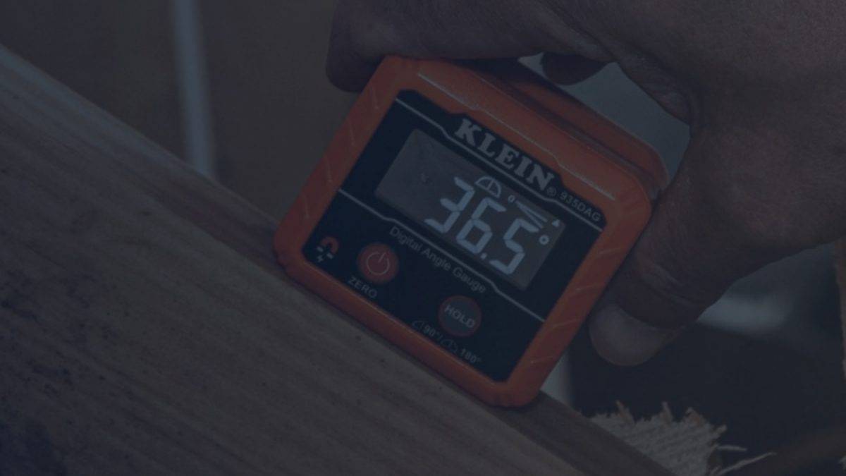 Man Using Digital Angle Gauge for Woodworking Project